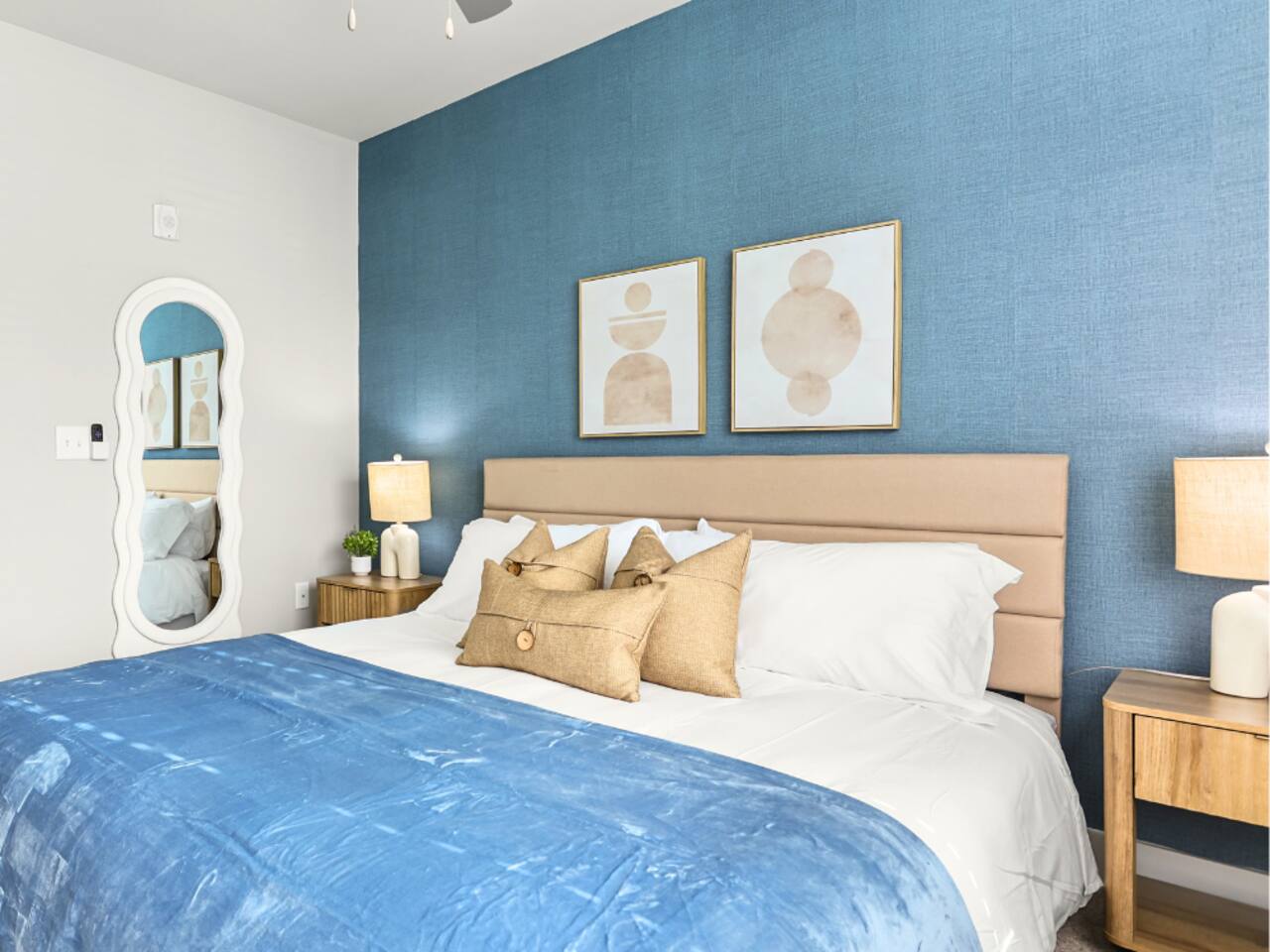 A blue-accented guest bedroom at a 1st Class Rentals property